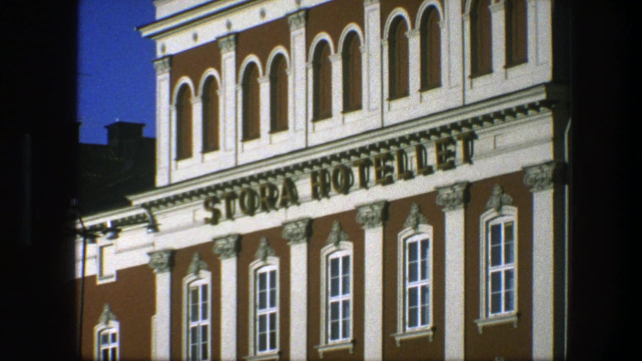 Hotel facade with Stora Hotellet sign, arched windows, and blue sky.