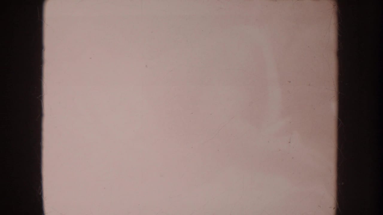 Soft pale pink 8mm frame divided by dark vertical film edges.
