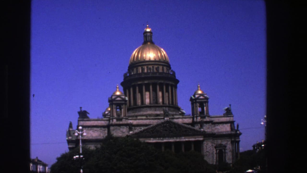 Similar view of the gold-domed building with dark borders and blue sky.