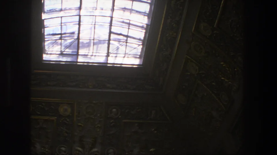 1975 Denmark 8mm view of a church skylight framed by dark carved ornament and painted ceiling surfaces.