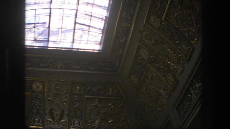 1975 Denmark 8mm view of an ornate church ceiling with a bright skylight, carved trim and painted architectural detail.