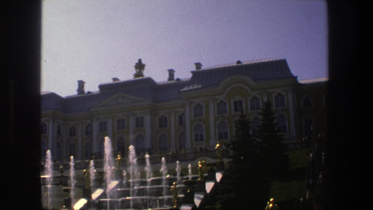 Classical palace facade behind fountains with dark 8mm frame edges.