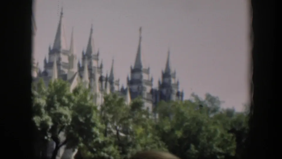 The final 1951 Wyoming frame shows spires and treetops with the landmark partly cropped by the 8mm film border.