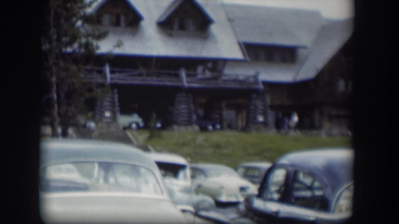 The final frame shows several rounded 1950s cars below a rustic Wyoming lodge, with indistinct visitors near the front entrance.