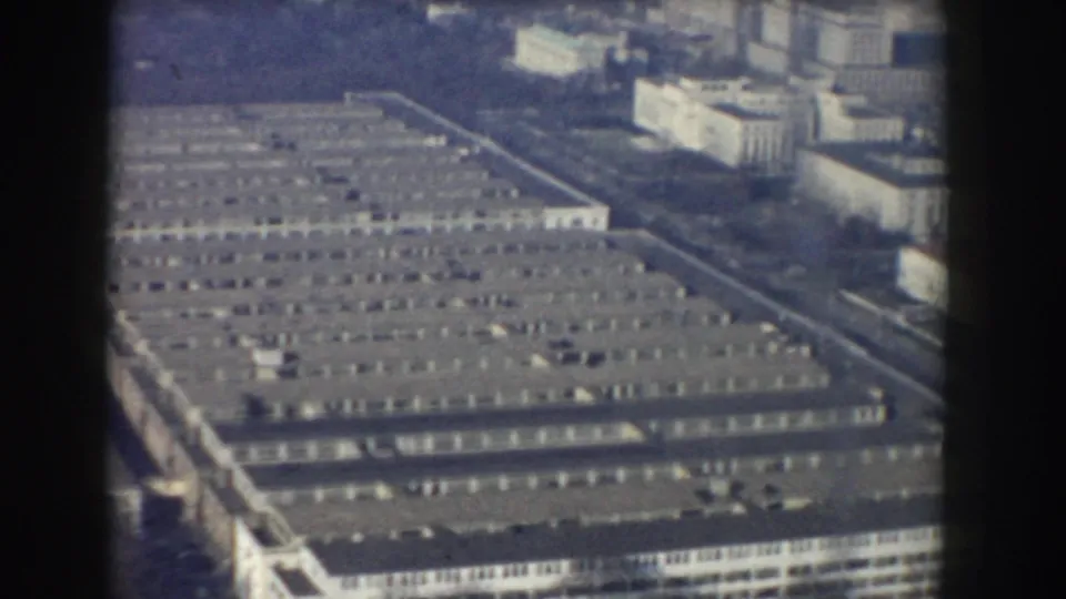 1960 Washington, DC aerial frame centered on the Pentagon's roof geometry, with streets and nearby buildings partly visible.