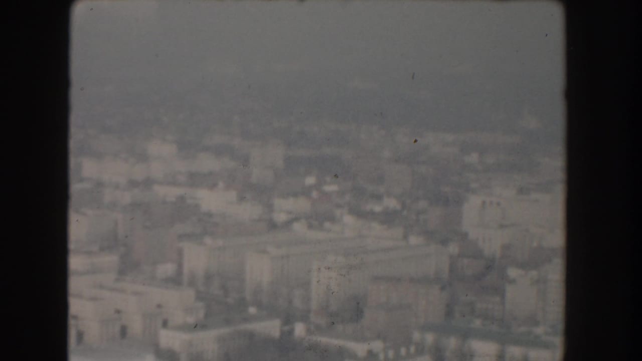 Aerial view over large government buildings and city blocks in Washington DC.