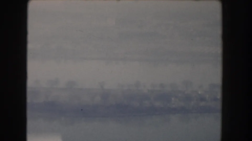1960 Washington DC 8mm frame with a soft, hazy distant landscape or skyline and heavy dark frame edges.