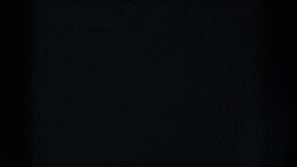 Black 8mm frame from the 1960 Washington, DC reel, with slight tonal shifts and no recognizable scene content.
