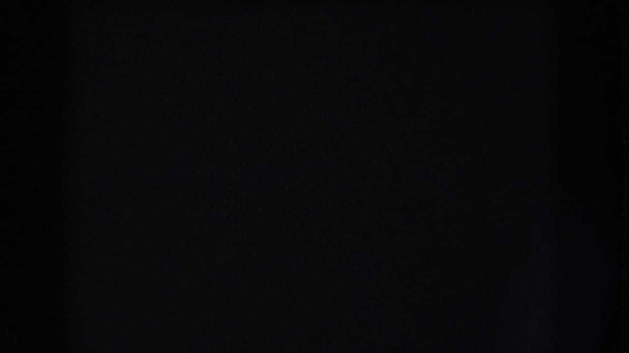 Dark 1960 Washington, DC 8mm frame with a subtle vertical band, grain, and no identifiable subject visible.