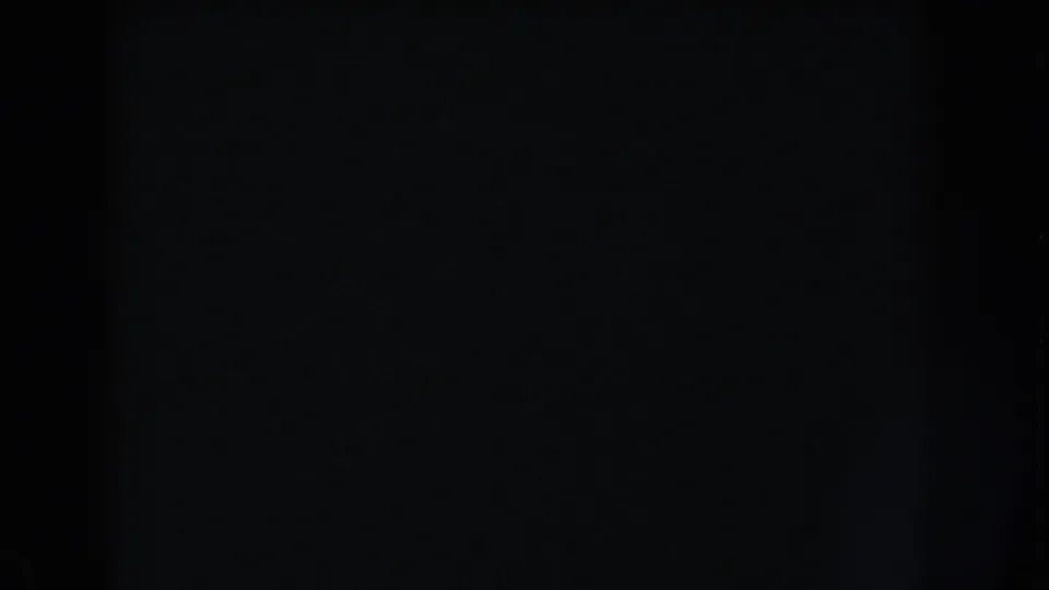 Dark 1960 Washington, DC 8mm frame with a subtle vertical band, grain, and no identifiable subject visible.