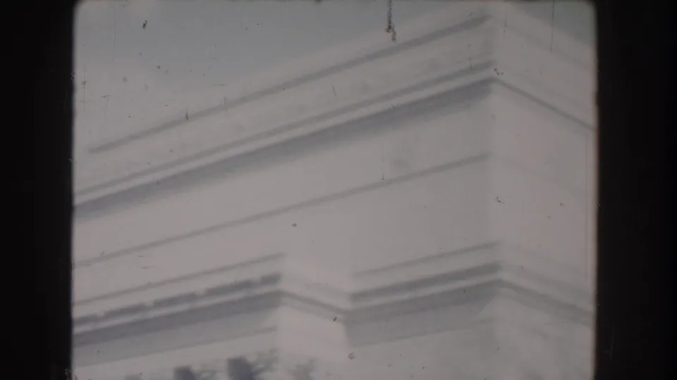 1960 Washington, DC home-movie frame emphasizing Jefferson Memorial stone trim and cropped column detail.