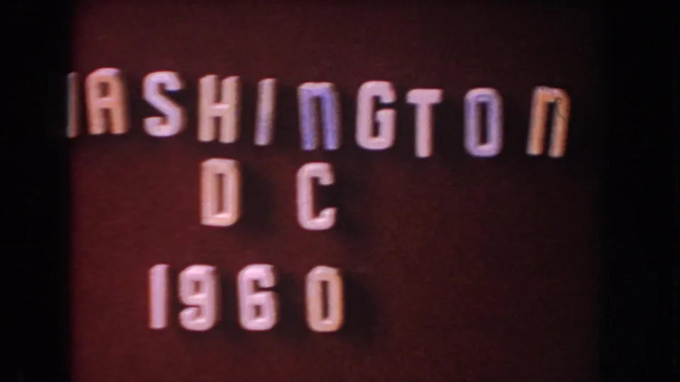 Home-movie title card reading Washington DC 1960, with white raised lettering on a red background.