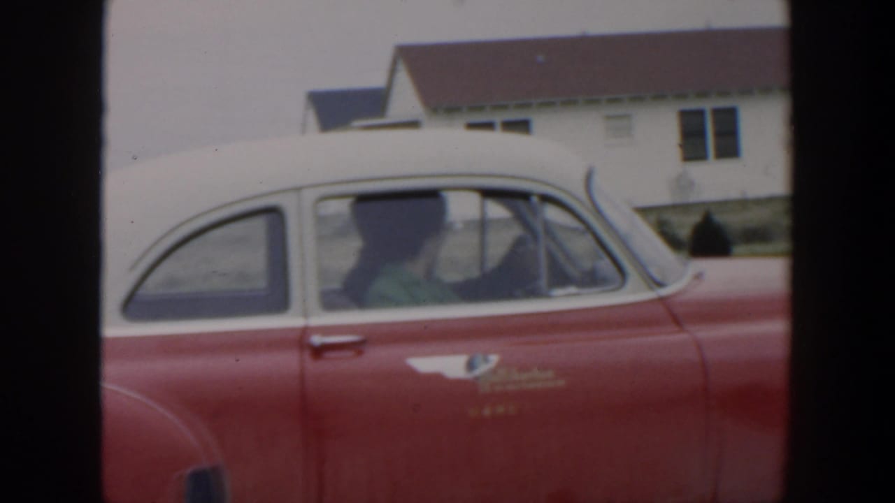 Side view of the car with the driver turned inside the cabin.