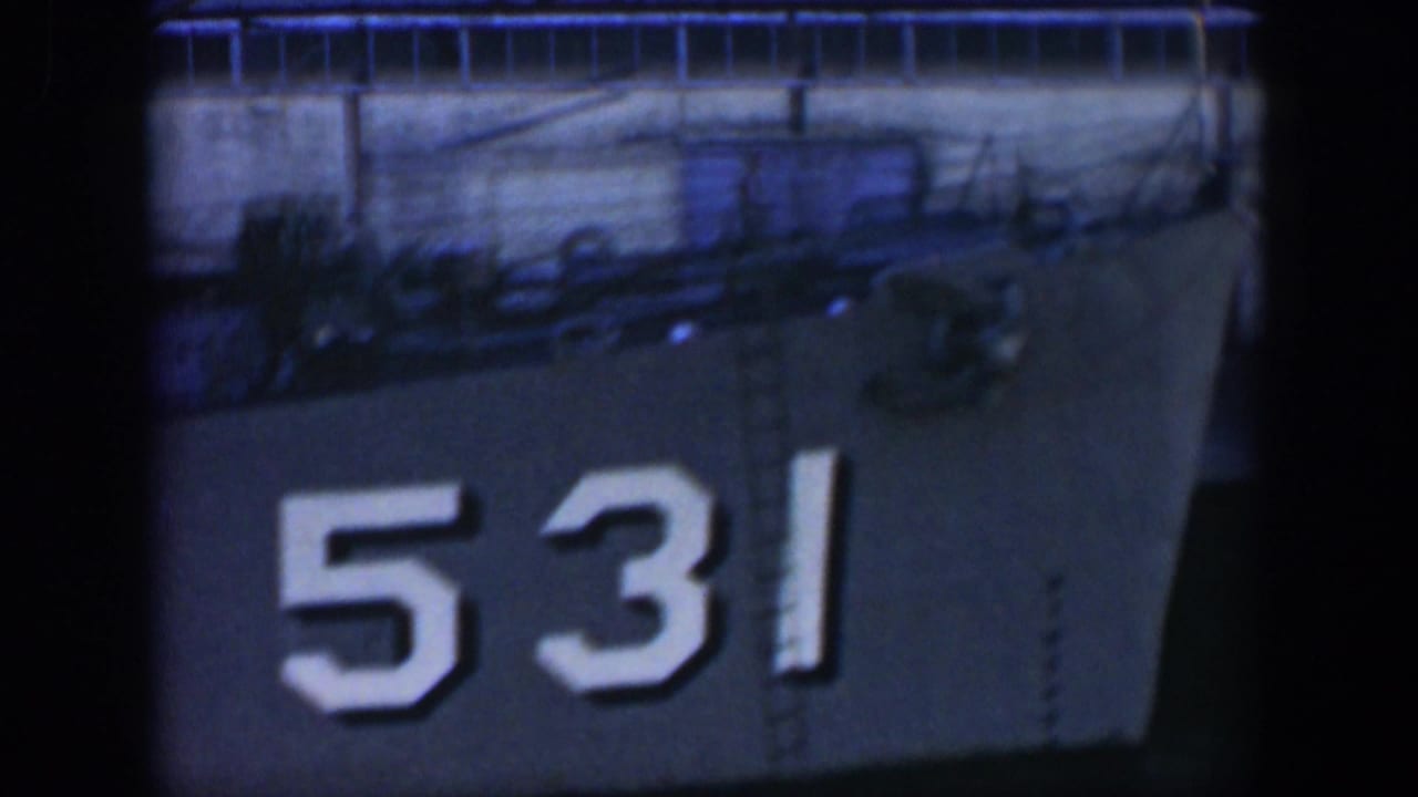 1951 Cuba home-movie frame showing a docked gray vessel with hull number 531 and deck fittings above the side.