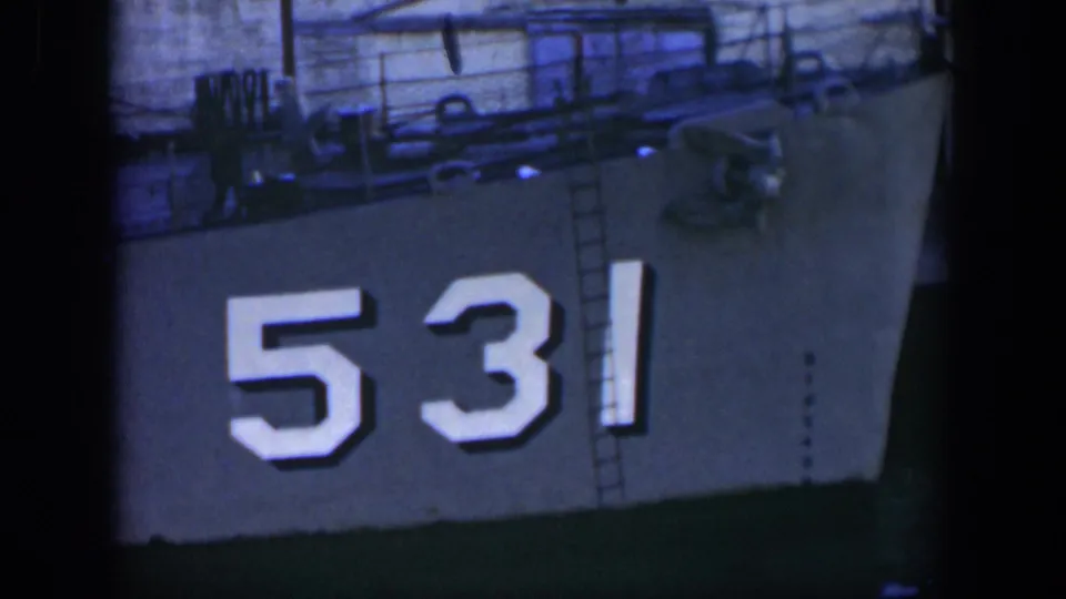 A gray vessel side in Cuba footage shows the large white hull number 531, with a ladder and railings on deck.