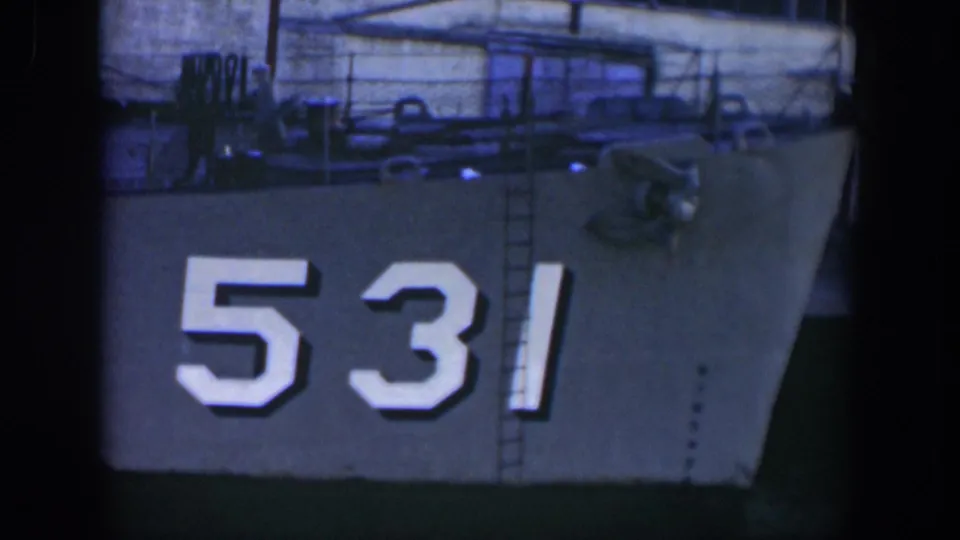 The ship's side remains centered on the white number 531, with deck railings and a ladder visible above in 1951 Cuba footage.