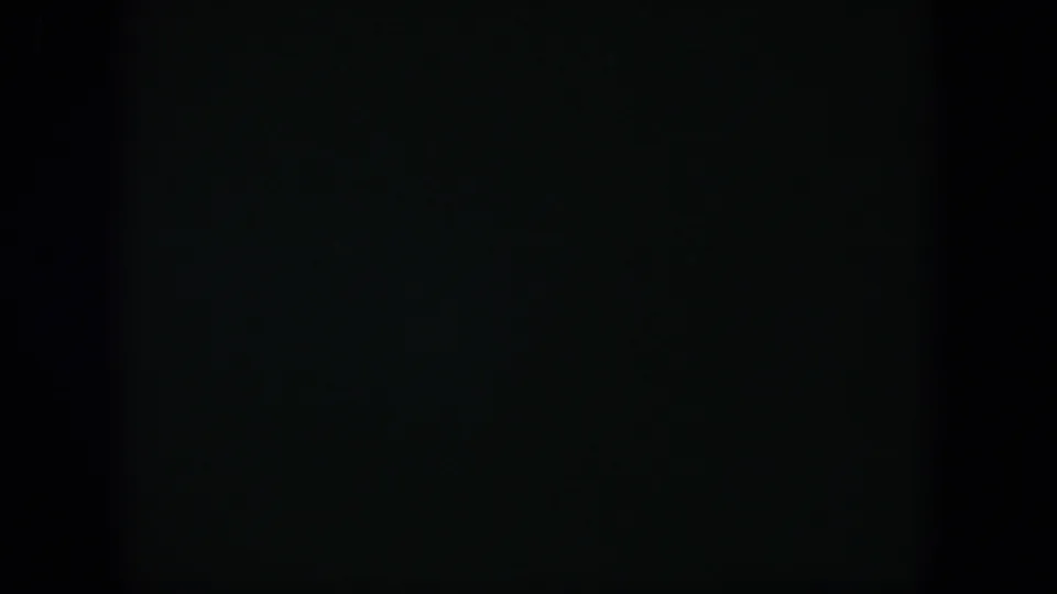 A mostly black 8mm frame with faint greenish texture, likely a brief dark section within the 1951 Cuba reel.