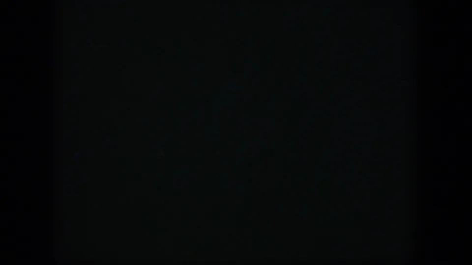 1951 Cuba 8mm frame with almost no discernible subject, showing a faint horizontal boundary and low-level grain.