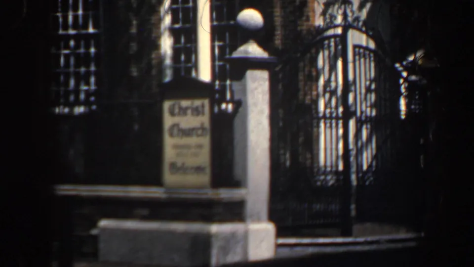 1962 Philadelphia close view of a Christ Church welcome sign beside a stone pillar and black iron gate.