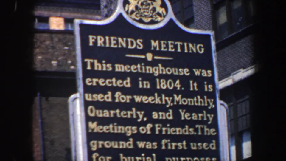 Tight 8mm frame of the Friends Meeting marker in Philadelphia, with text about meetings and burial use partly readable.