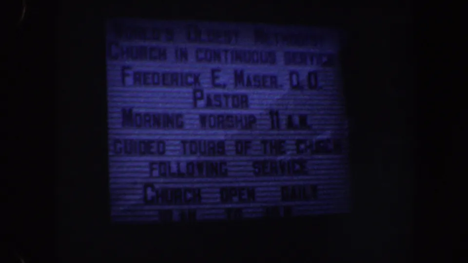 Final 8mm frame shows the St. George's Methodist Church sign in Philadelphia with readable pastor, worship, and guided-tour information.