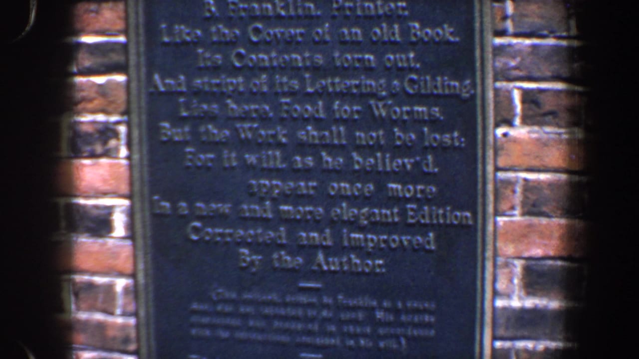 Closer view of the right side of the Franklin plaque and surrounding brick.