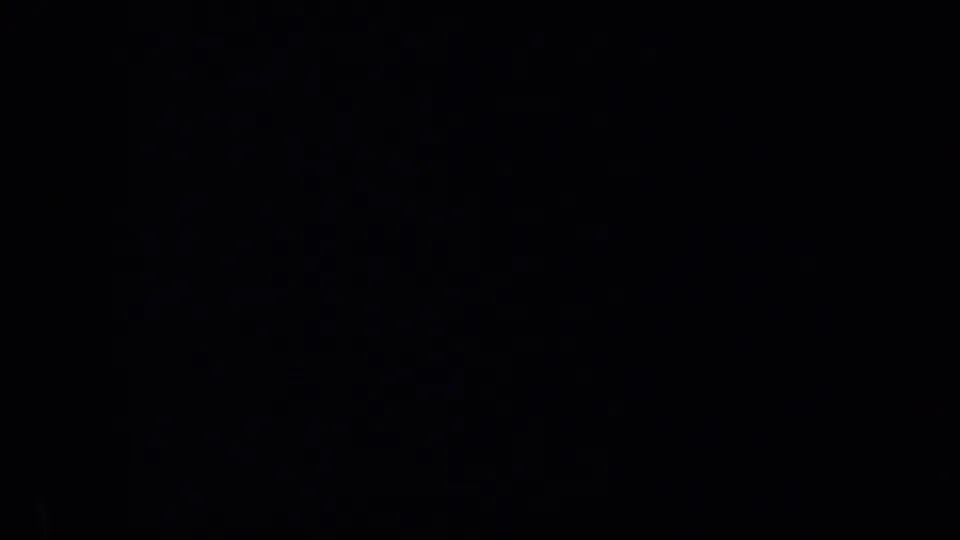 Mostly black 8mm home-movie frame with indistinct dark forms and visible grain, supported by 1957 San Francisco metadata.