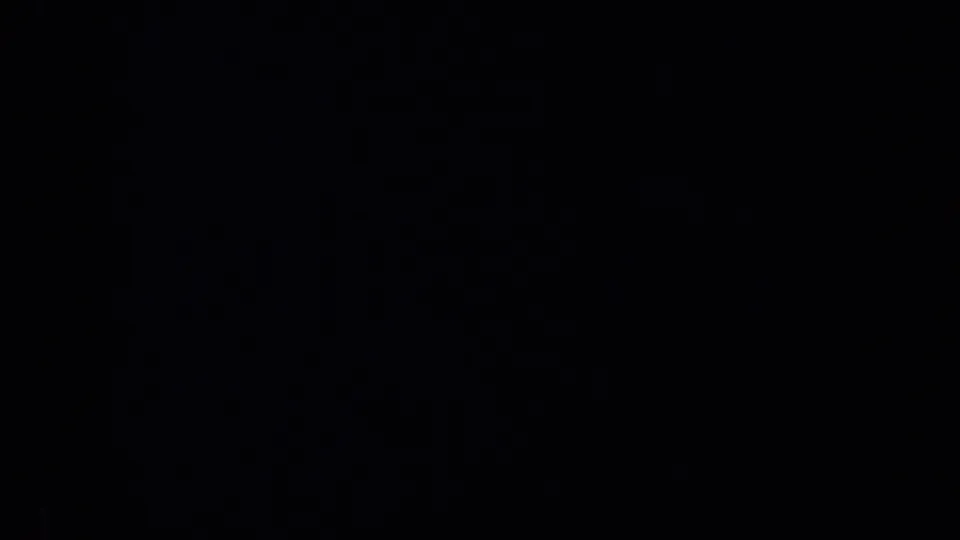 A nearly black 1957 San Francisco 8mm frame with faint edge highlights and no identifiable people, objects, or setting visible.