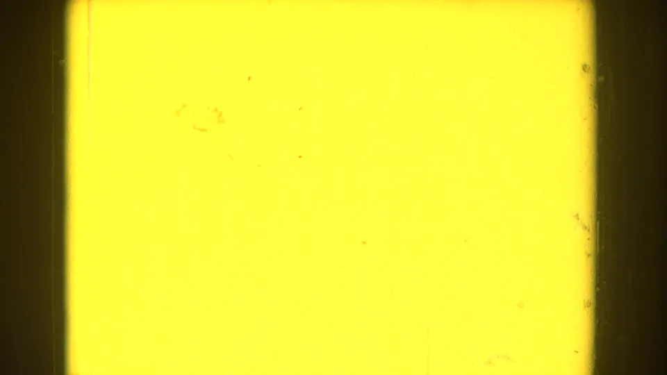 1959 Michigan 8mm frame with a bright yellow burn field, dark gate borders, dust, scratches, and uneven exposure density.