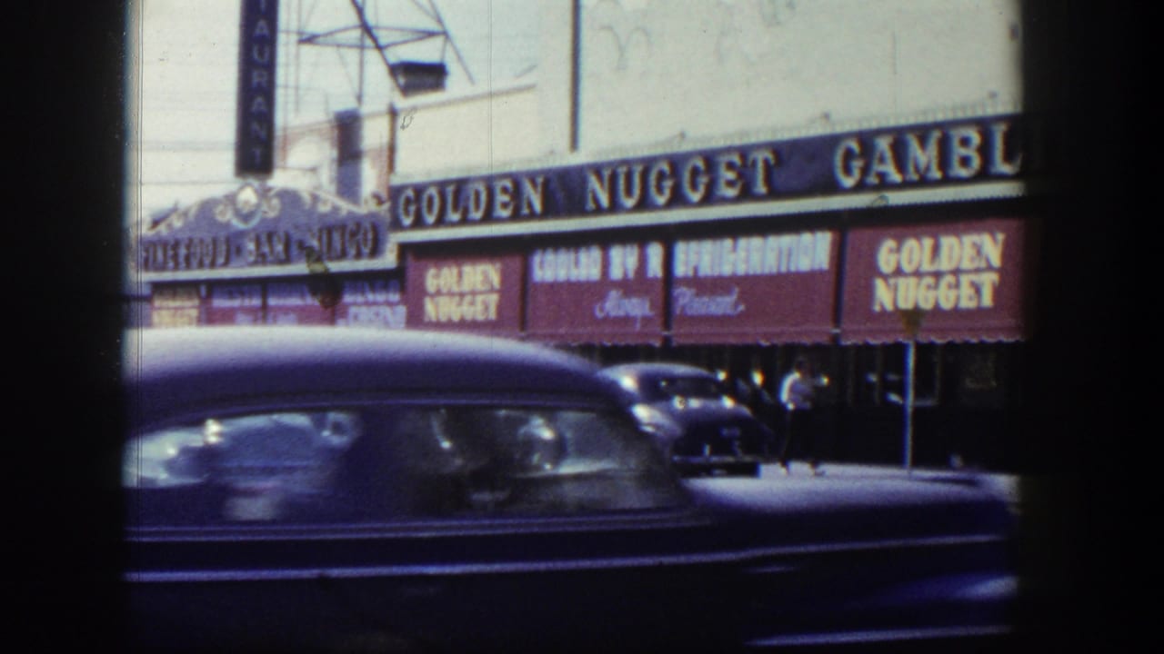 Golden Nugget street frontage with a dark car passing in the foreground.