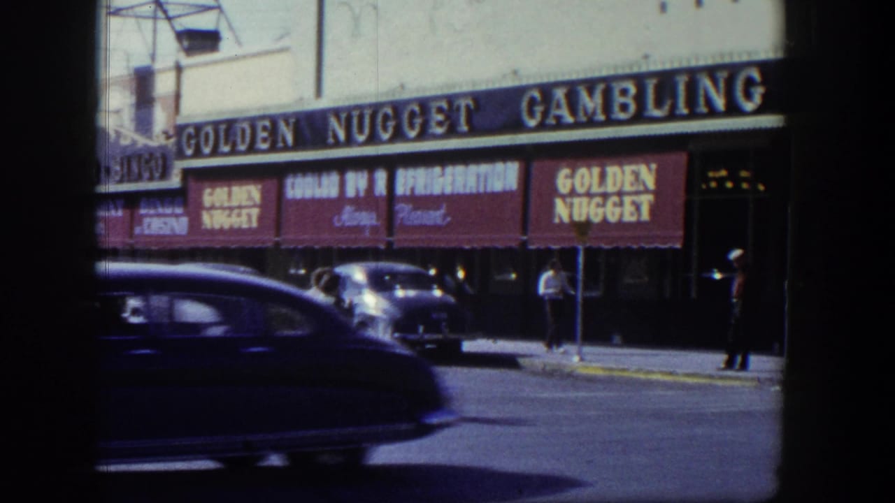 Golden Nugget awnings and marquee with cars and pedestrians along the street.