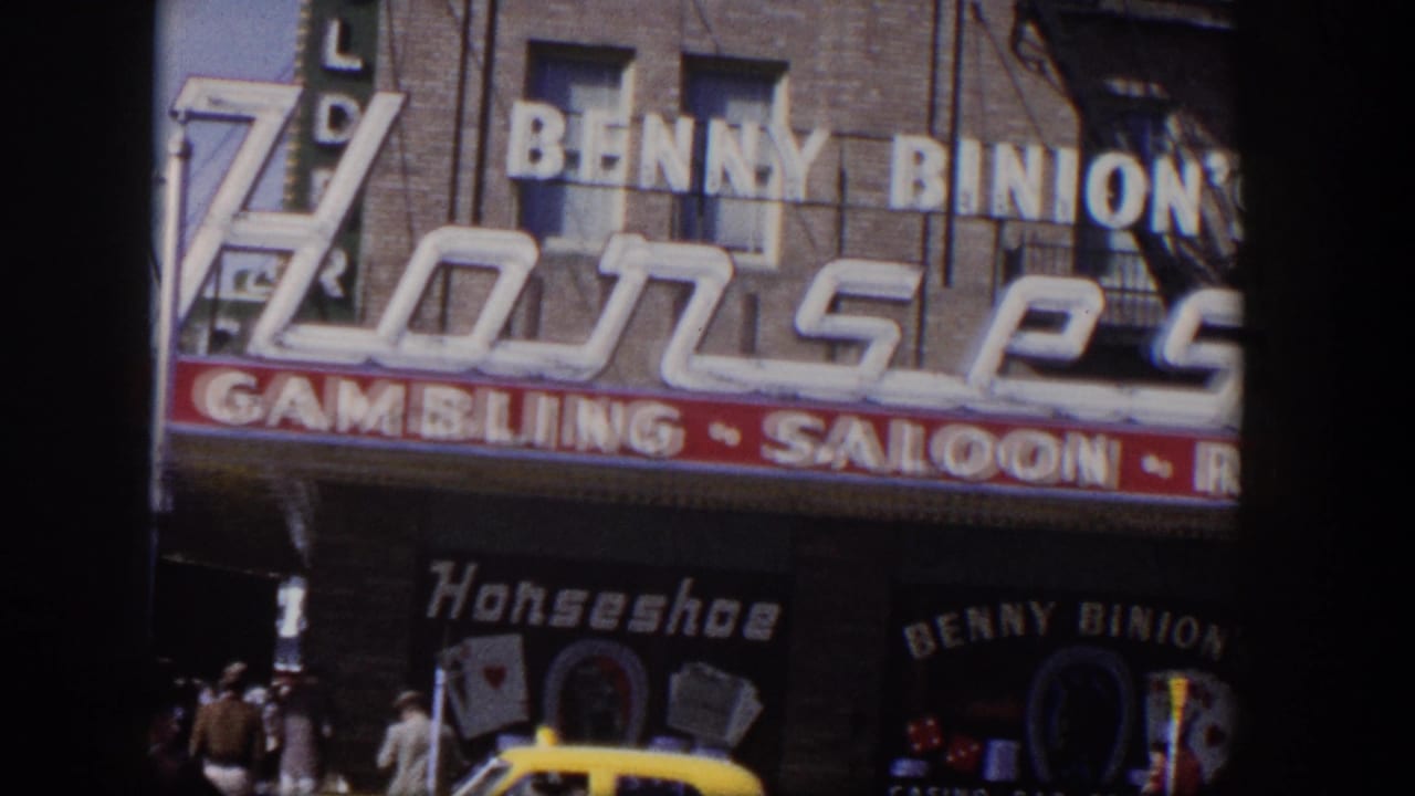 Benny Binion's Horseshoe storefront with gambling saloon signage and a yellow taxi below.