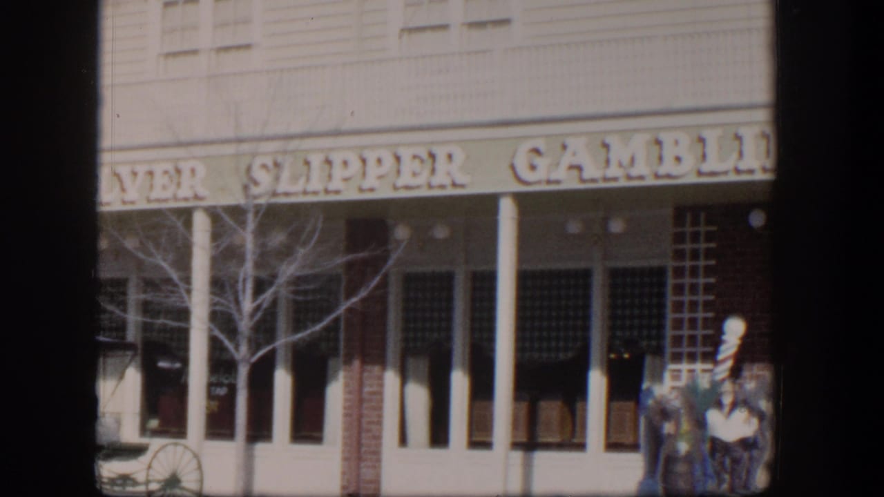 Silver Slipper Gambling facade with people near the entrance and a bare tree in front.