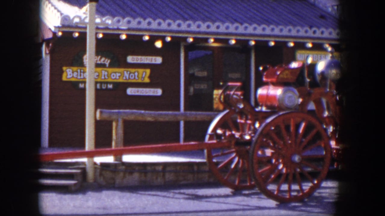 Red antique fire engine outside a Believe It or Not! museum facade.