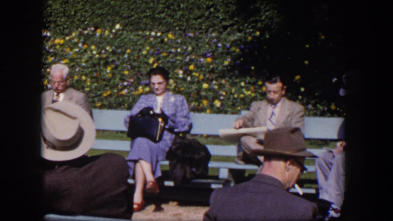 1954 Las Vegas park scene with adults on benches, including a woman reading and men in suits and hats in bright sun.