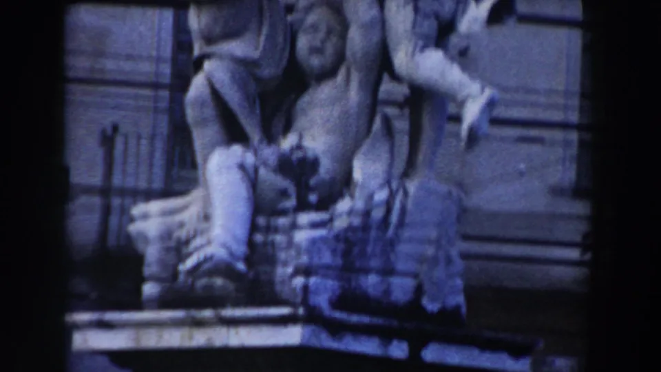 1959 Pisa church exterior detail showing sculptural stone figures, steps, and surrounding architectural ornament.