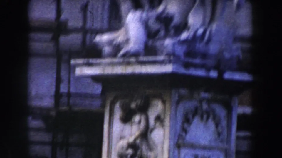 Close view of a carved animal figure and ornamented stone base in the cataloged 1959 Italy city-square footage.