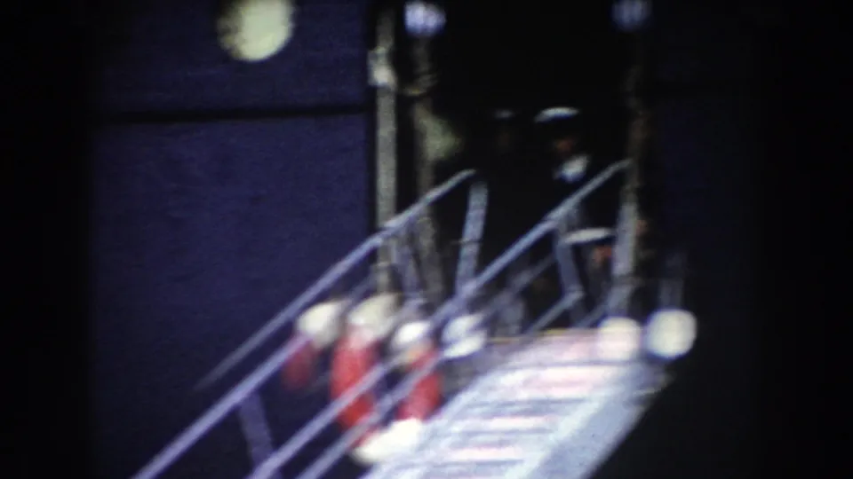 Pisa, Italy 1959 frame showing the aircraft gangway and open doorway under strong night lighting.