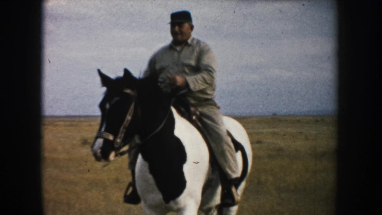 Near the end of the 8mm clip, the South Dakota rider appears closer on the pinto horse, with prairie and cloudy sky behind.