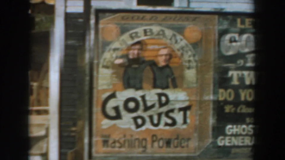 1961 Knott's Berry Farm storefront with Fairbanks Gold Dust Washing Powder sign, Gold Dust Twins artwork, and adjacent ghost town store lettering.