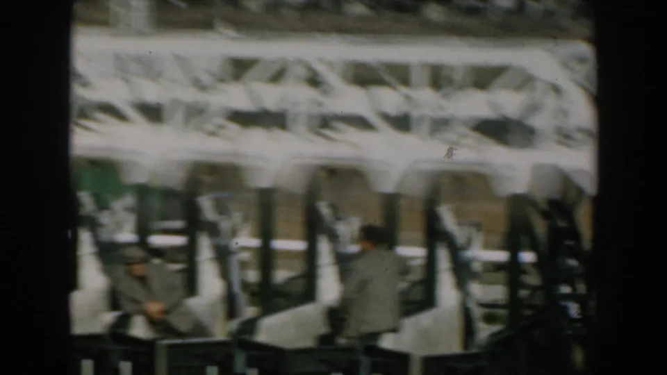 1962 Greece footage appears to show passengers moving or waiting near rows of seats inside a ferry or transport boarding area.