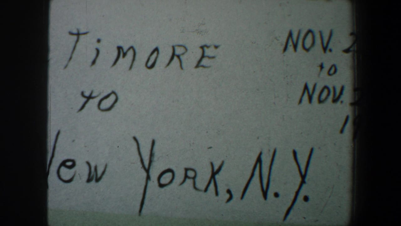 1960 8mm home-movie title card with partial Baltimore to New York, N.Y. wording and cropped November date text.
