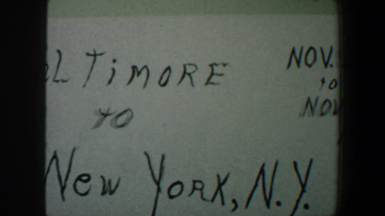 8mm frame showing the lower handwritten travel note, including “New York, N.Y.” and partial November date writing near the right edge.