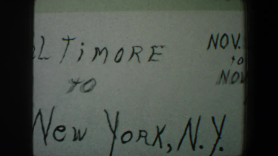 8mm frame showing the lower handwritten travel note, including “New York, N.Y.” and partial November date writing near the right edge.