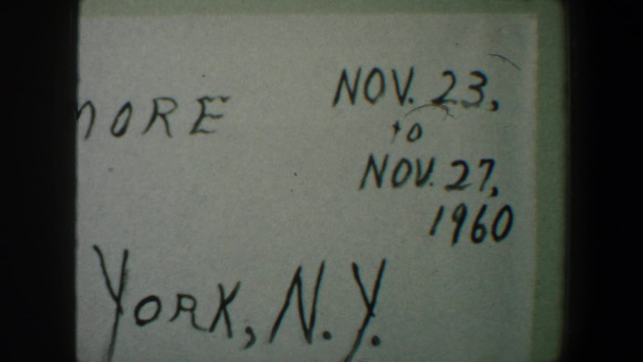 1960 home-movie title card showing handwritten Nov. 23 to Nov. 27 dates and New York, N.Y. text in soft focus.