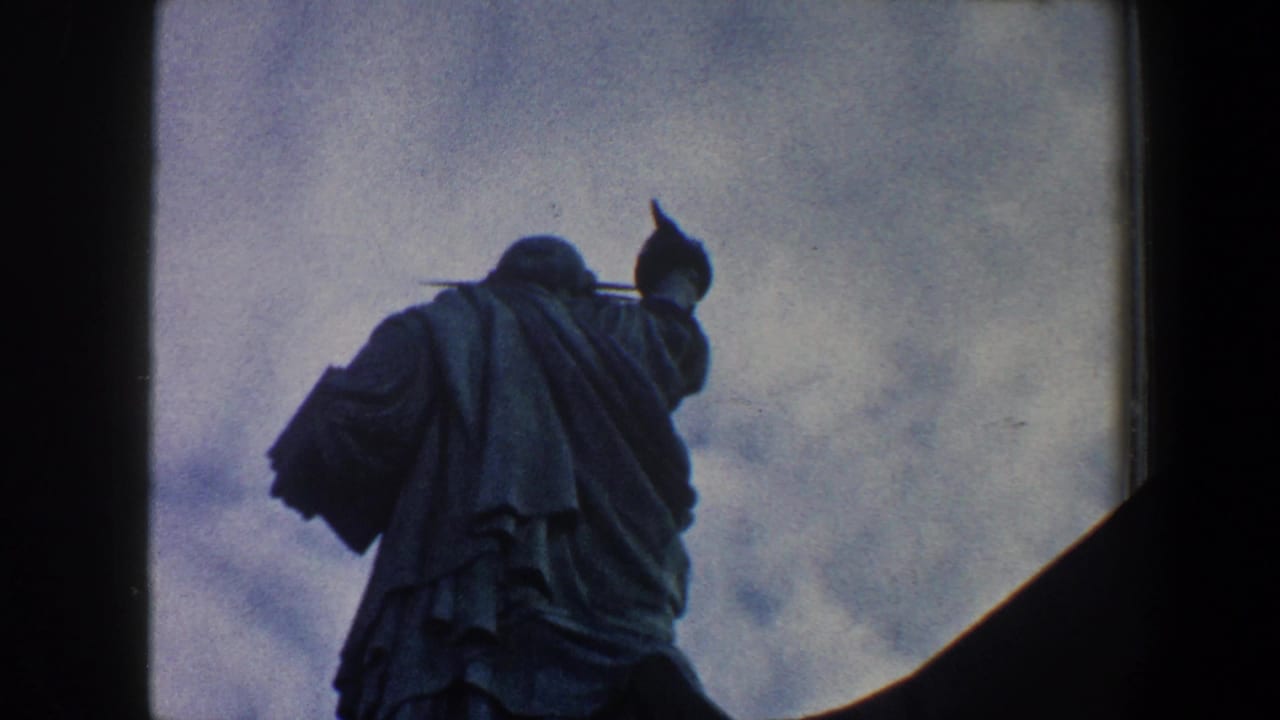 Statue of Liberty viewed from below with dark framing at the edge.