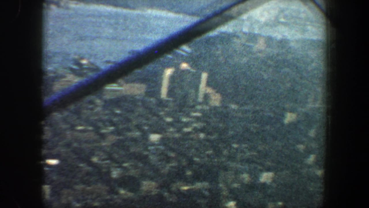 Elevated city and river view partly crossed by a diagonal blue structural beam.