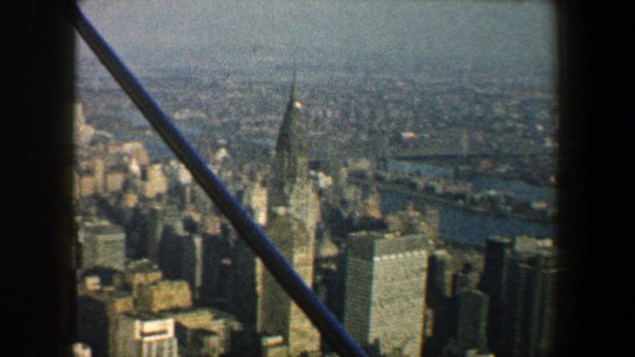 Manhattan skyline with the Chrysler Building seen past dark structural framing.