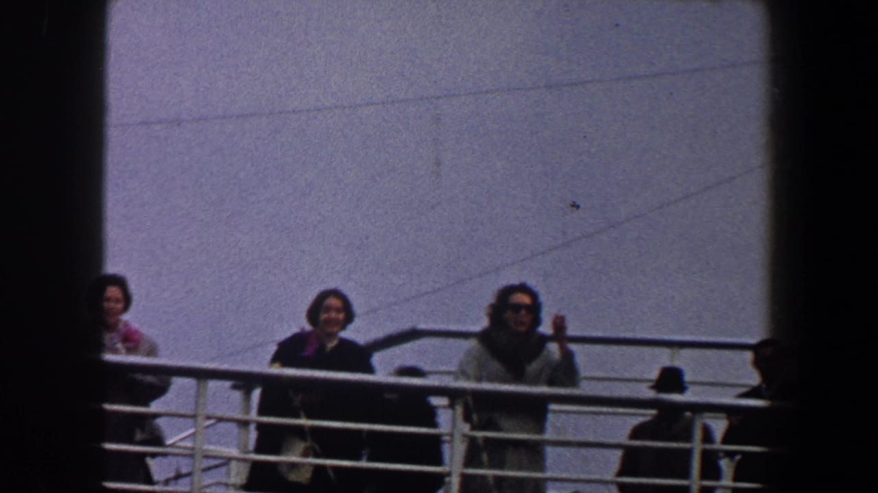 Three women remain by the ship railing while dark foreground bars divide the view.
