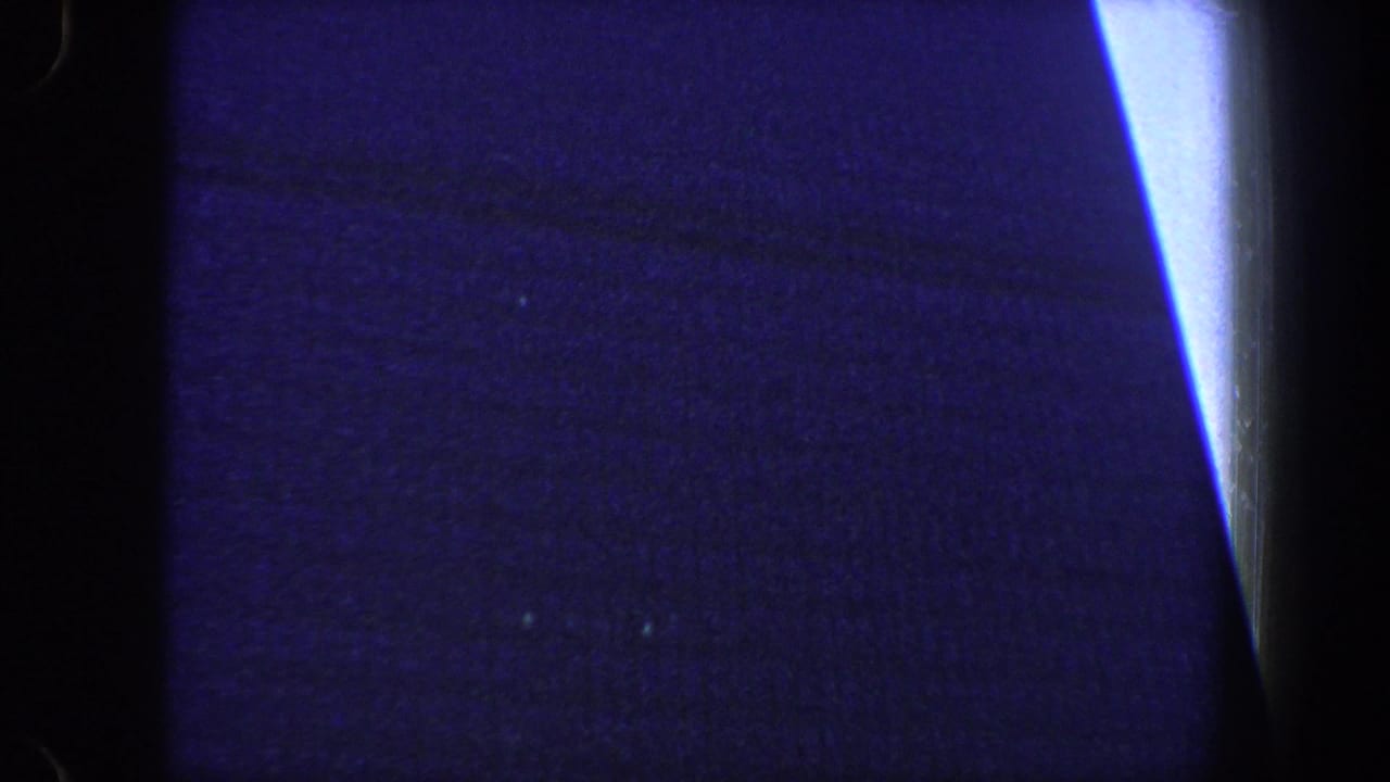 Dark blue vertical composition with a bright light strip along the right edge.